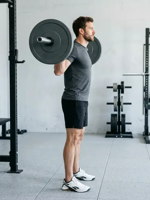 Animated loop of the back squat showing the start, midpoint and finish of one repetition